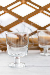 Two empty glass glasses for serving cold summer cocktails. vertical position.