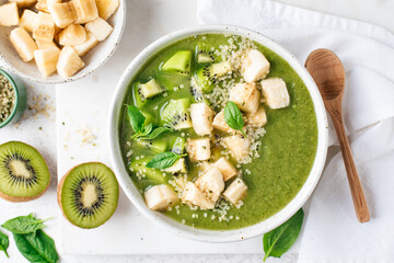 Healthy vegan detox green smoothie bowl with various toppings. Closeup view. Weight loss, diet...