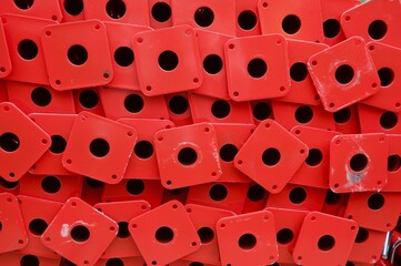 Stack of red construction material metal pipes