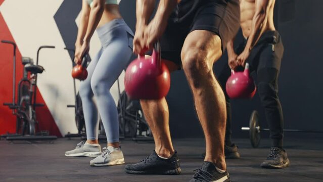 Groups of people having exercise class together in the gym, 