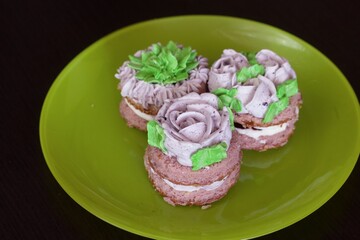 Biscuits with lavender cream. Arranged on a plate.