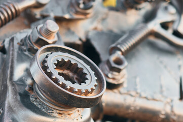Details of a metal mechanism close up. rusty surfaces. Bolts, springs, levers and gears. Abstract industrial background. Selective focus.