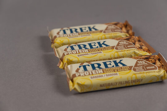 Three TREK Protein Energy Bars on Gray. A gluten-free, sugar-free snack. Products of the British company Natural Balance Foods. Healthy Foods. Ukraine, Mykolaiv - 06 22 2022