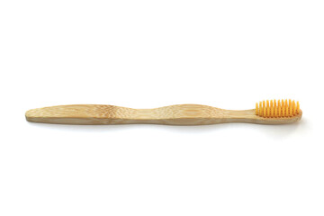 wooden toothbrush on a white background, the concept of abandoning plastic, zero waste