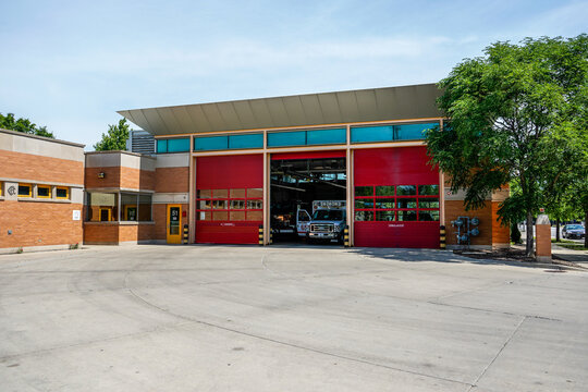 Chicago, Illinois, United States - July 2022. Station 18, Fire station. Location of the filming for the television show Chicago Fire. Middle garage door is open allowing a view of an ambulance.
