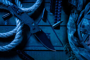 Military composition with a knife and cartridge cases. Military knife, shell casings and...