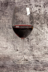 Glass of red wine on endless marbled background