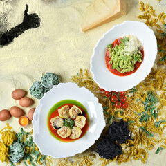 Italian dishes Fusilli and Conchiglioni. Pasta with sauce and cheese. Background for the menu. Top view