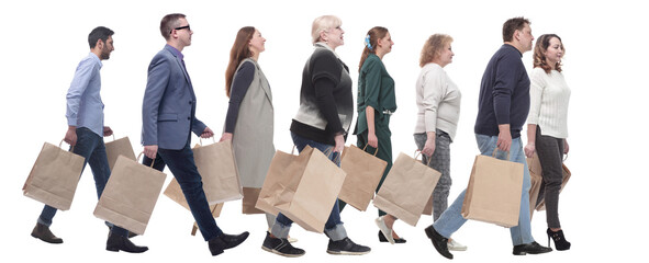 a group of people are running paper shopping bags