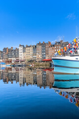 Honfleur, beautiful city in France, the harbor in the morning, reflection on the river
