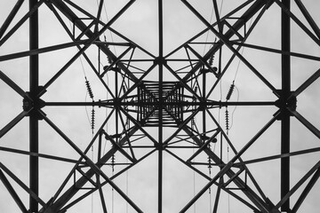 Bottom up view of high-voltage transmission tower.