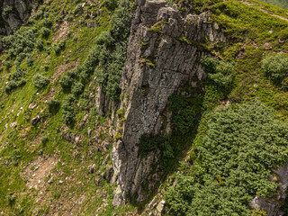 Panoramic aerial view of mountains in summer. Hiking destination. Alpine meadow