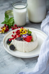 ..Fresh ricotta with berries and flowers