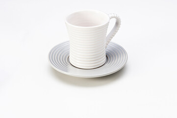 Modern white empty ceramic cup with saucer, isolated on white