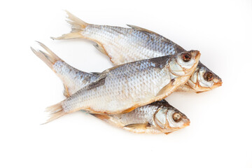 Dry fish. Seafood snack for beer. Salted sun-dried, jerked or smoked fish. Taranka, vobla. Russian or Ukrainian food. Caspian roach fish. Dead fish. High resolution photo. On white background