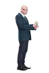 personable business man with a wad of dollar bills