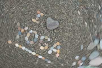I Love Yoga Text made from stones on beach.