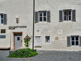 The grave of Franz Gruber, the composer of the song Silent Night, and the facade of his museum...