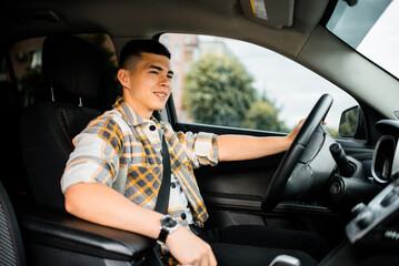 Young man driving a car