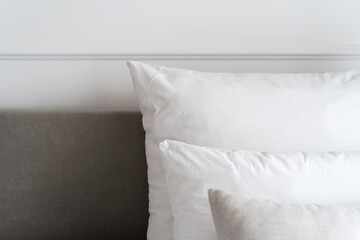 Fototapeta na wymiar Hypoallergenic pillows on bed in hotel room
