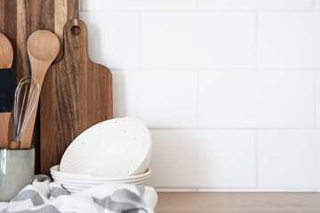 Utensils and kitchenware collection on wooden shelf