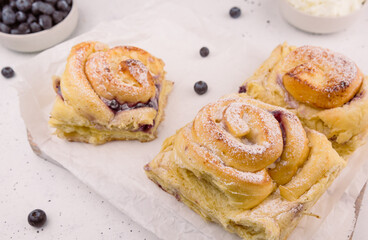 sweet bun with blueberries and curd cheese