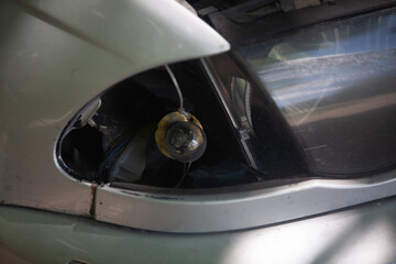 Broken car turn signal on a silver car