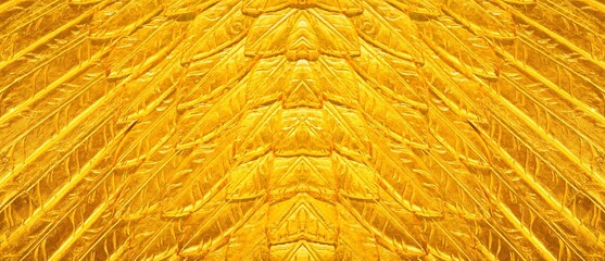 Abstract foil textured yellow gold background. 
Abstractly designed surface, golden shiny metallic design, copy space and no people.