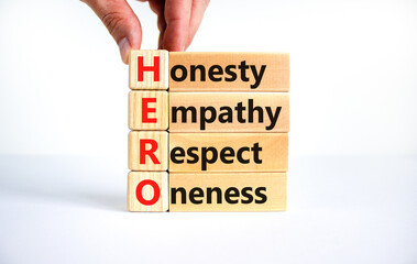HERO honesty empathy respect oneness symbol. Concept words HERO honesty empathy respect oneness on blocks on beautiful white background. HERO honesty empathy respect open-mindedness concept.