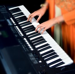 Playing musical keyboard closeup shot
