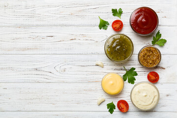 Many different sauces and herbs on table, flat lay top view. sauces with spices healthy concept