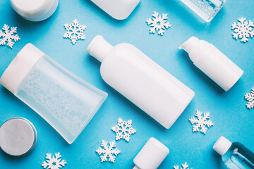 Makeup products and Christmas decorations on color background. Top view New year Beauty concept