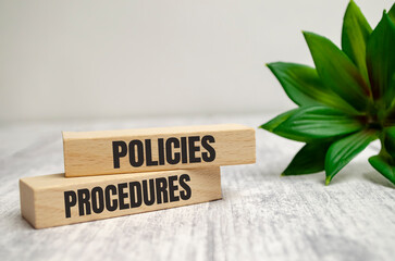 policies and procedure word written on wood block on white background - obrazy, fototapety, plakaty