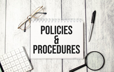 policies and procedure text on notepad with glasses, pen and calculator - obrazy, fototapety, plakaty