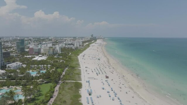 many people at beach for summer vacation in miami florida east coast summer day