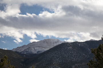 Snowfall in the Rocky Mountains of Colorado USA, blue sky with heavy clouds, horizontal aspect