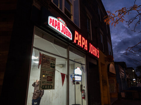 TORONTO, CANADA - NOVEMBER 14, 2018: Papa John's Logo In Front Of Their Local Fast Food In Toronto, Ontario. Papa Johns Pizza Is An American Braind Of Pizza And Pizzeria Restaurants