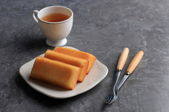 Homemade Financier Cake with Tea, Copy Space for Text. FInancier is French Cake with Butter