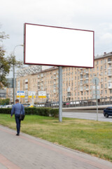Big billboard on the background of a blurred city.