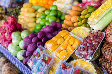 Various tropical fruits neatly arranged for sale at a public market in Tagaytay.