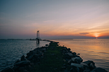 Colorful sunset over the pier on the oceanside in Cape Charles, Virginia