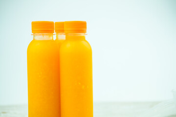 Three bottles fresh and healthy orange juice