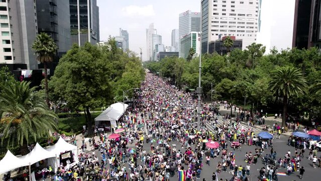 frontal drone shot of pride parade stands in paseo de la reforma avenue at mexico city