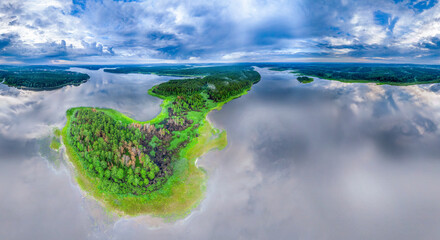 Big lake with green shores with morning fog in dawn, aerial landscape. Recreation concept. Aerial view