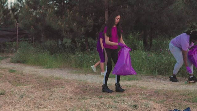 Plogging garbage volunteering multiethnic group. ecology plastic trash social services cleaning