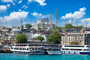 Fototapeta na wymiar Bosphorus strait in Istanbul, Bosporus tour boats and views of Istanbul mosques and historic center.