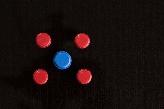 colored technological pipeline plugs for storing and transporting pipeline parts on a black background.
