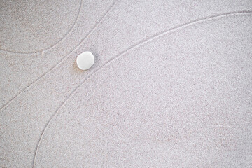 Zen Garden Japanese pattern on white sand background. buddhism texture wave on desert nature at...