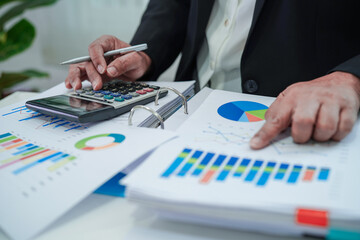 Fototapeta premium Businessman working and analysis with statistic graph in office.