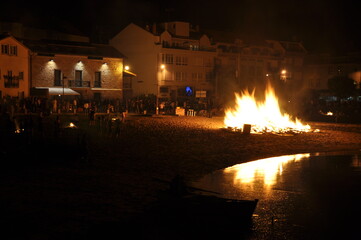 San Juan celebration on the beach. San Juan Holiday in Spain. Fire Tradition. - obrazy, fototapety, plakaty